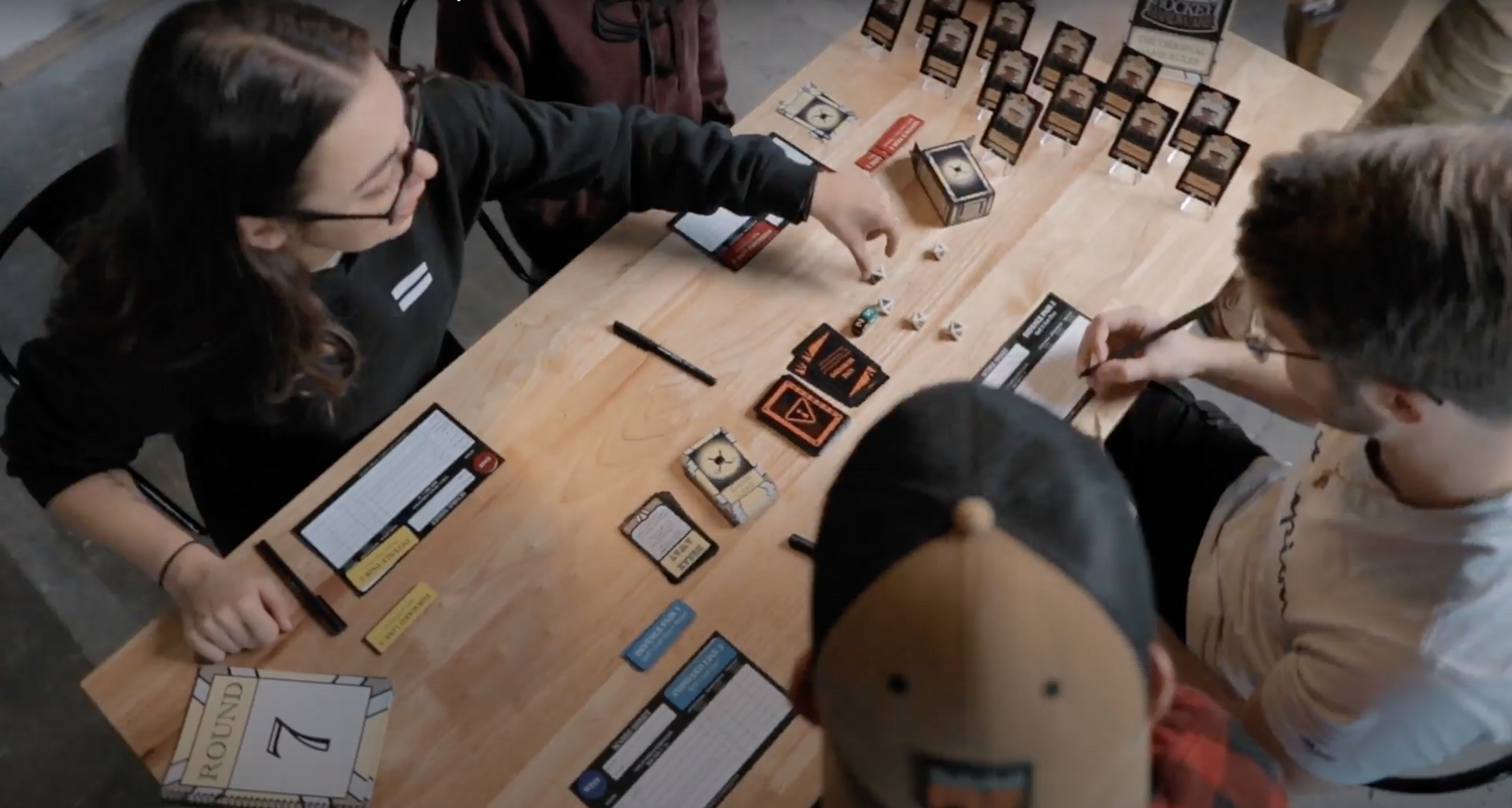 Young adults playing Hockey Hardware: The Original Game.